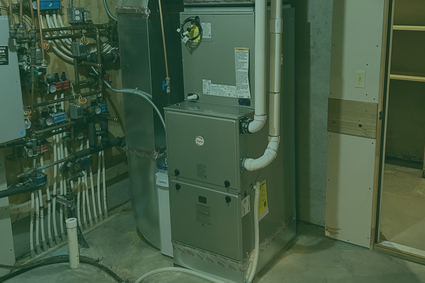 A Payne high-efficiency furnace with an AprilAire humidifier installed in a Twin Cities basement